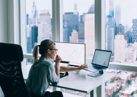 Two people looking at a server rack.